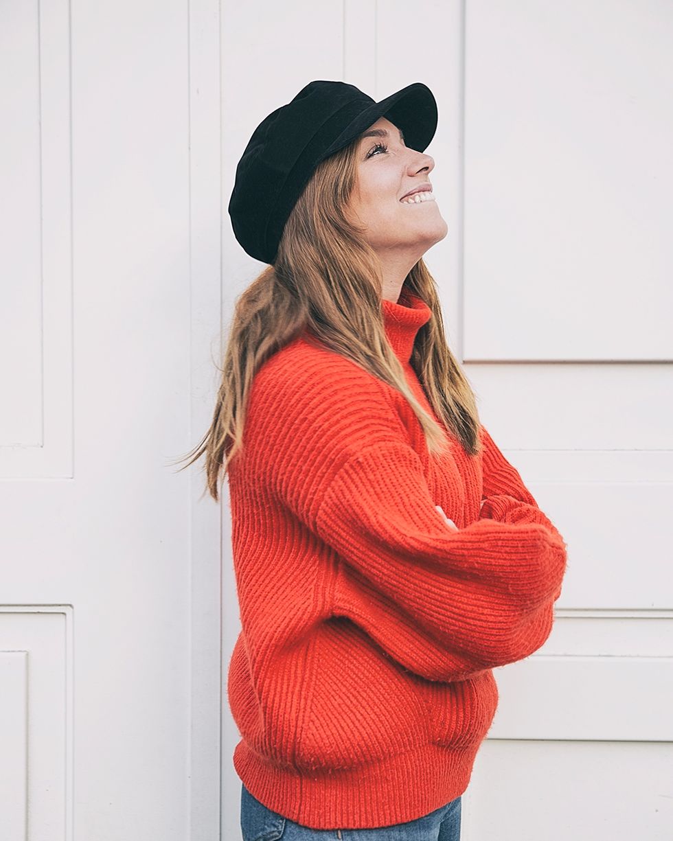 Clothing, Red, Outerwear, Orange, Beauty, Shoulder, Fashion, Sweater, Beanie, Headgear, 