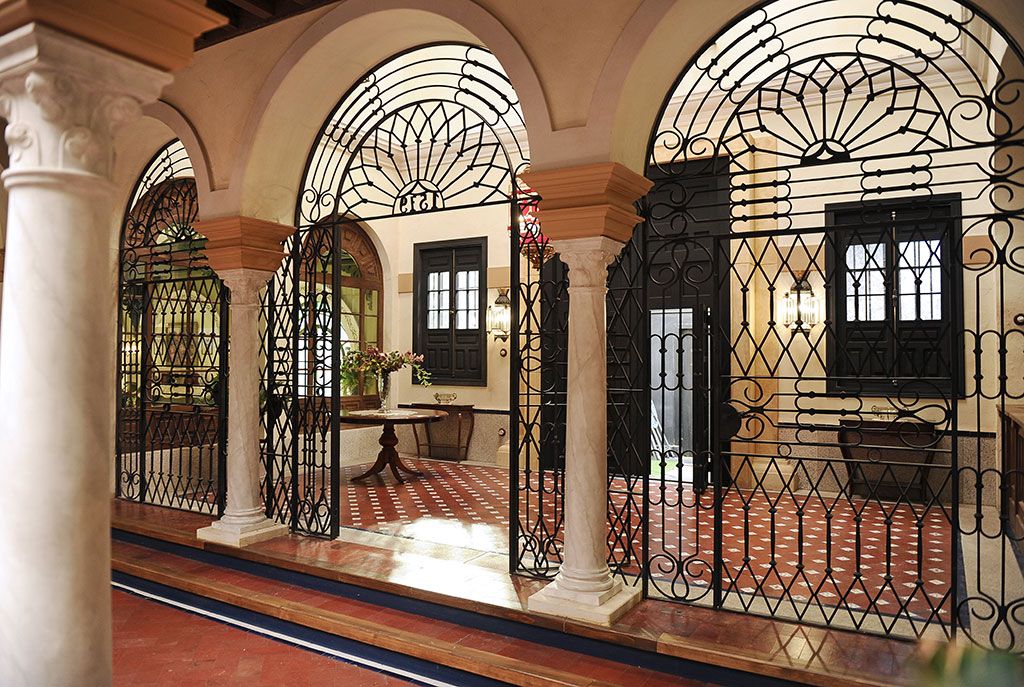 Arch, Property, Building, Architecture, Iron, Column, Interior design, Room, Window, Baluster, 