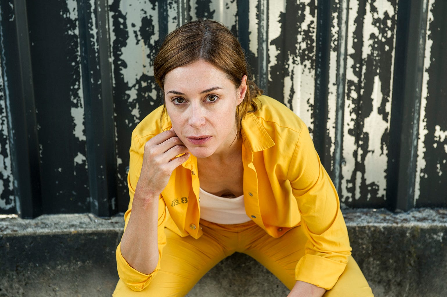 Yellow, Beauty, Eye, Outerwear, Photography, Photo shoot, Street fashion, Jacket, Sitting, T-shirt, 