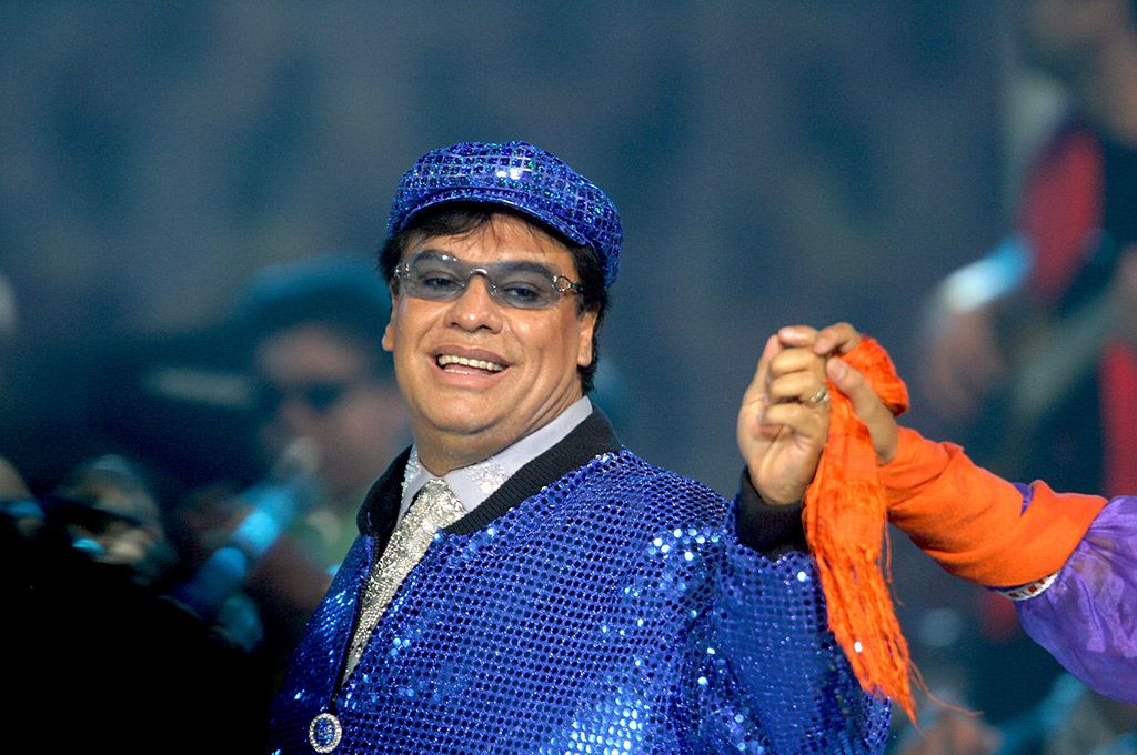 Eyewear, Happy, Facial expression, Headgear, Tradition, Costume accessory, Laugh, Turban, Gesture, Pleased, 