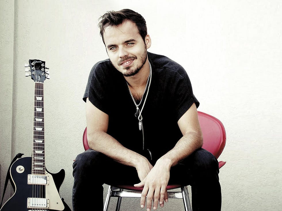 Human body, Musical instrument, Facial hair, Sitting, Musician, Guitar, Elbow, Jewellery, String instrument, Plucked string instruments, 