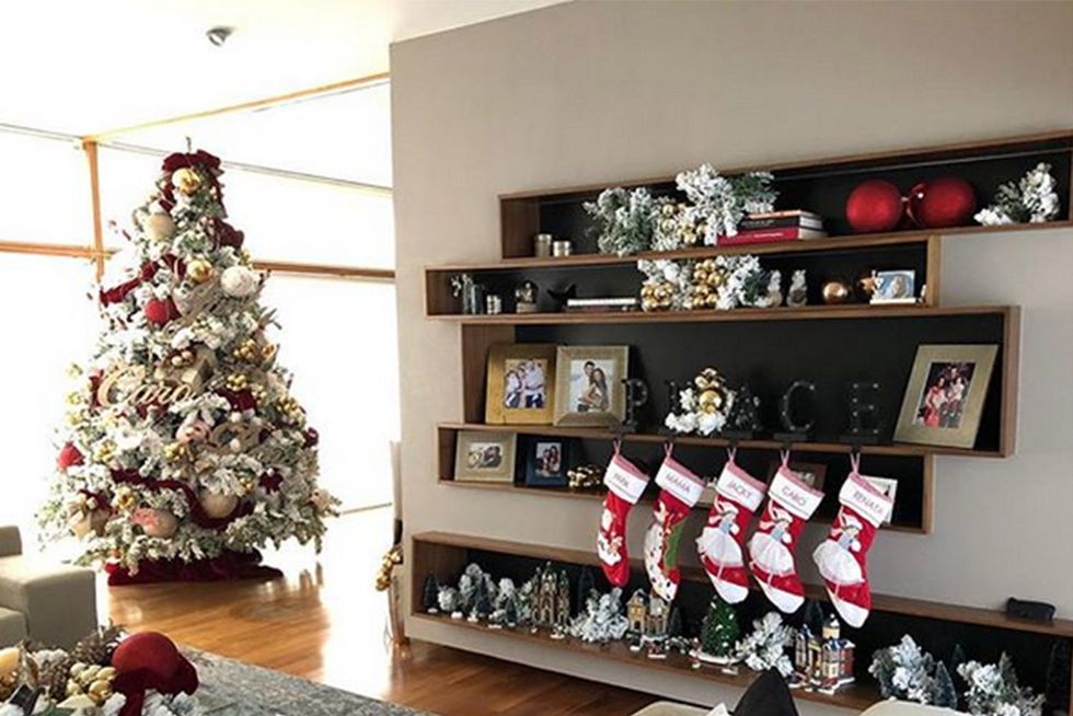 Christmas decoration, Christmas tree, Room, Interior design, Property, Living room, Christmas, Home, Table, Christmas stocking, 