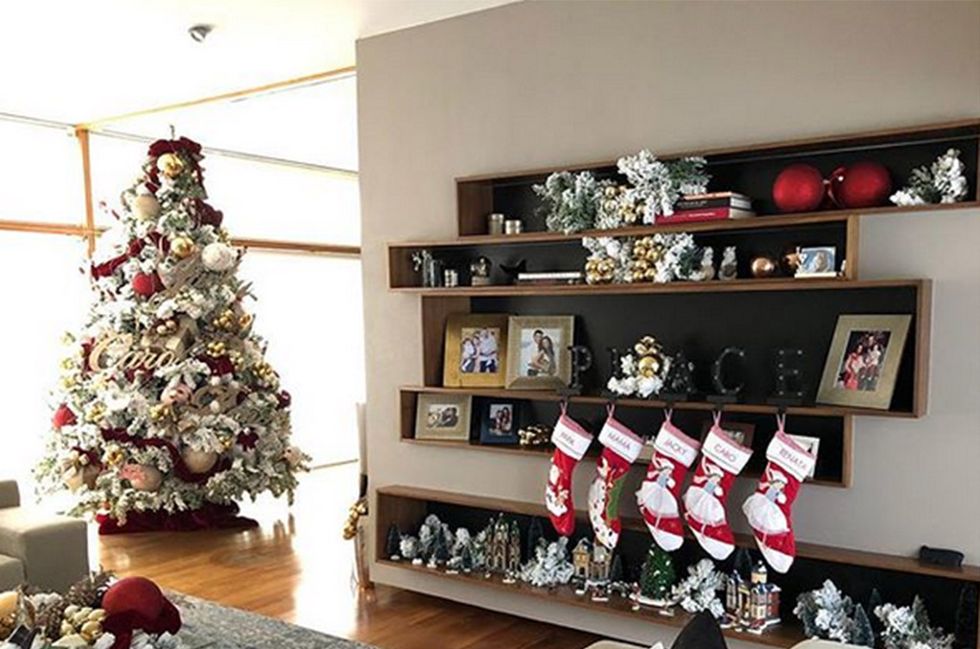 Christmas decoration, Christmas tree, Room, Interior design, Property, Living room, Christmas, Home, Table, Christmas stocking, 