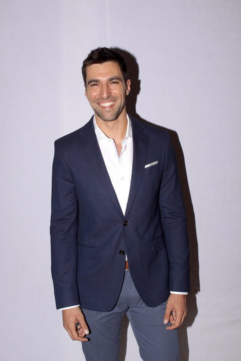 Suit, Clothing, Blazer, Outerwear, Formal wear, Jacket, Hairstyle, Tuxedo, Standing, Fashion, 