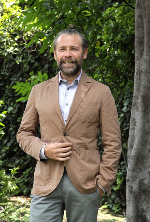 Clothing, Brown, Dress shirt, Coat, Collar, Sleeve, Trousers, Facial hair, Shirt, Textile, 