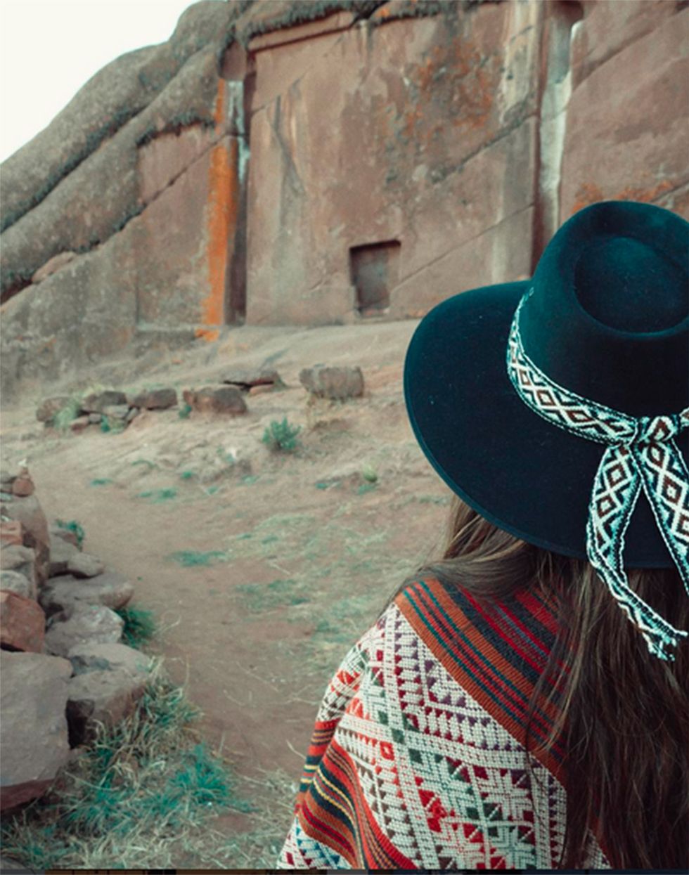 Turquoise, Wall, Hat, Sun hat, Headgear, Fashion accessory, Landscape, Photography, Neck, Tourism, 