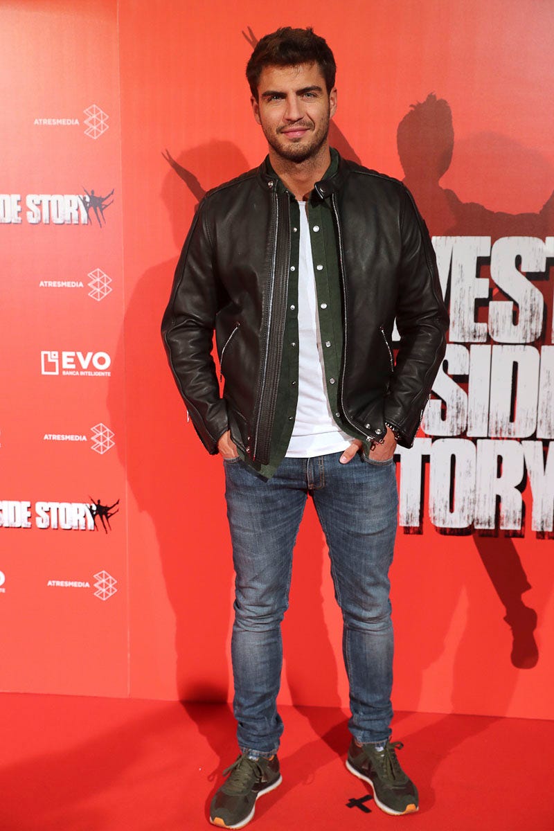 Red, Premiere, Carpet, Facial hair, Leather, Jacket, Jeans, Outerwear, Denim, Textile, 