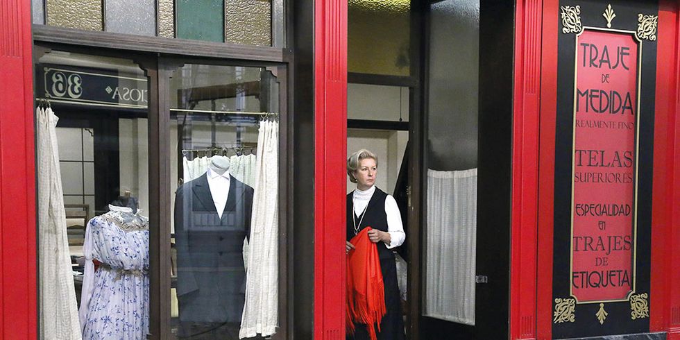 Red, Snapshot, Door, Outerwear, Telephone booth, Street, Formal wear, Building, 