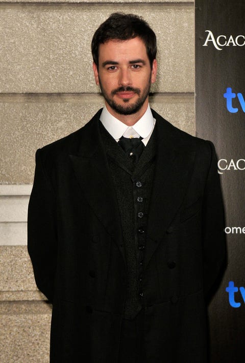 Clothing, Coat, Dress shirt, Collar, Facial hair, Suit, Outerwear, Formal wear, Bow tie, Style, 