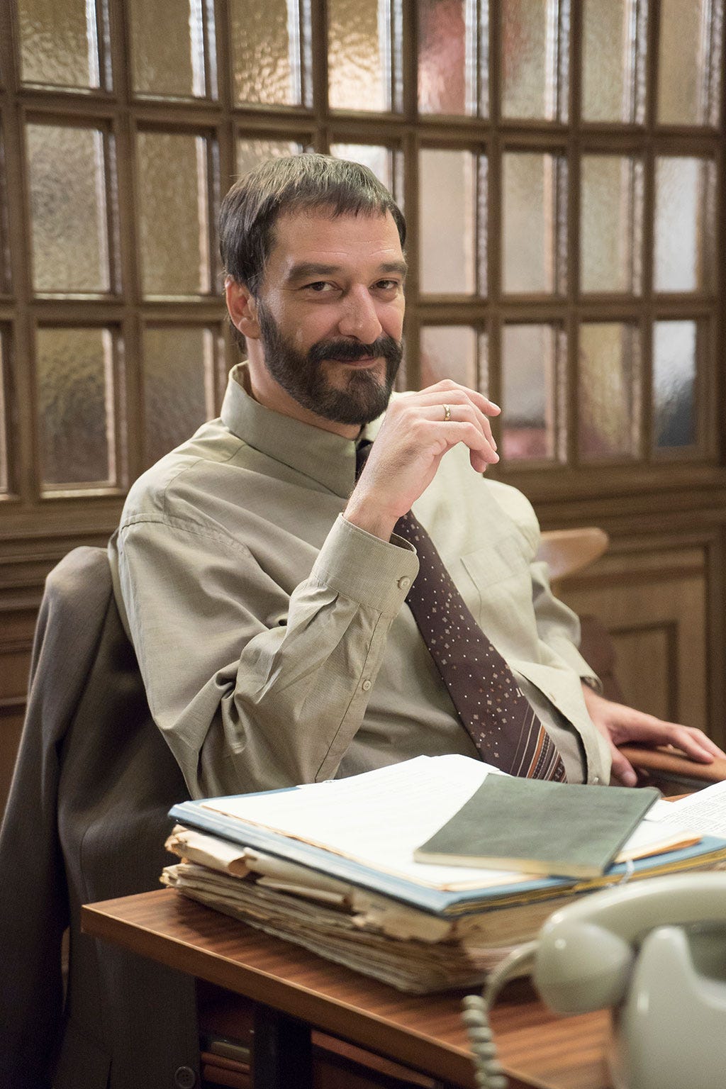 Facial hair, Dress shirt, Beard, Sitting, Moustache, Publication, Book, White-collar worker, Reading, Coffee cup, 