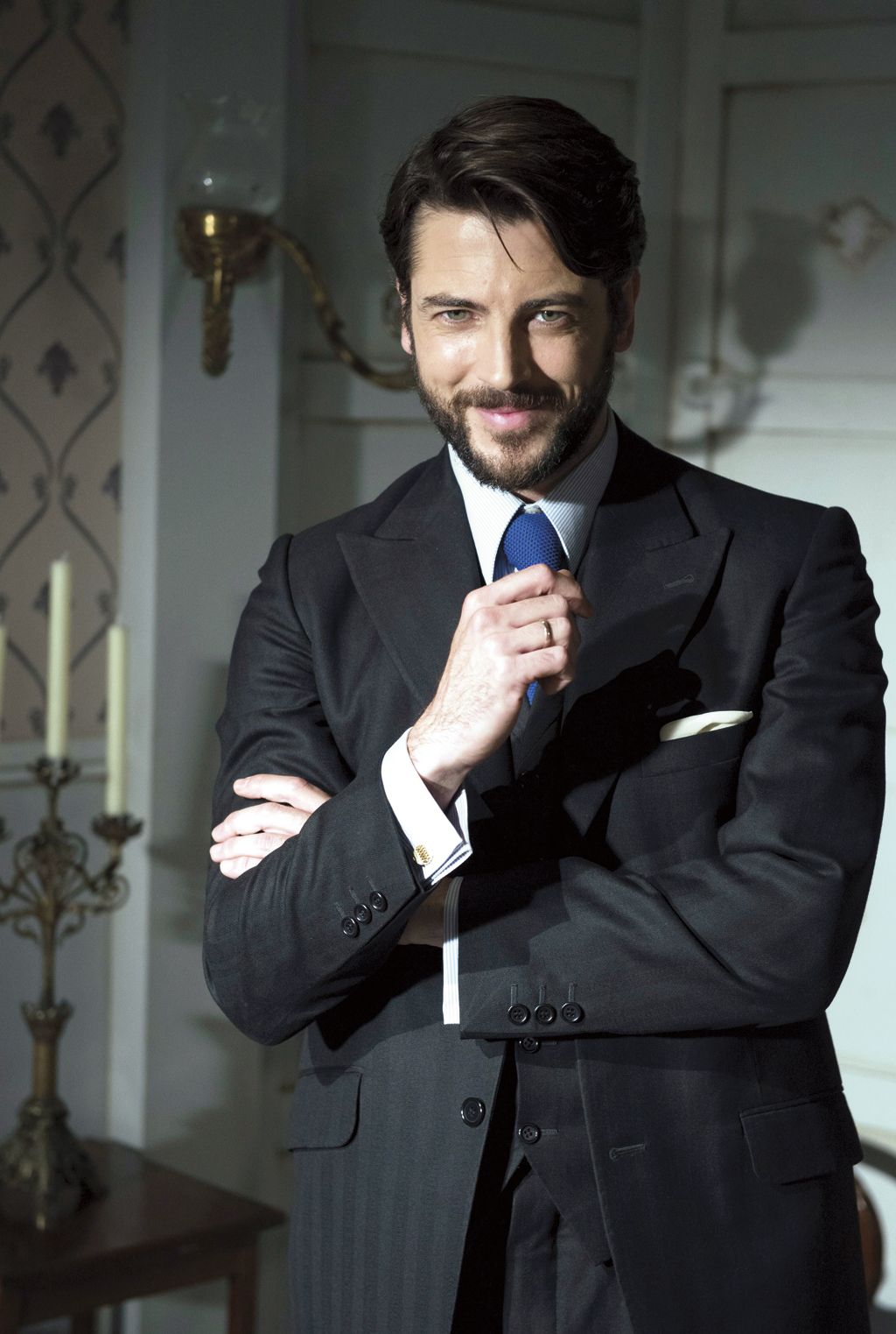 Clothing, Facial hair, Dress shirt, Coat, Collar, Shirt, Suit, Outerwear, Standing, Formal wear, 