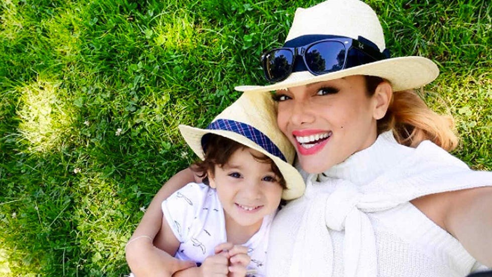 Facial expression, Hat, Grass, Child, Smile, Fun, Sun hat, Fashion accessory, Headgear, Happy, 