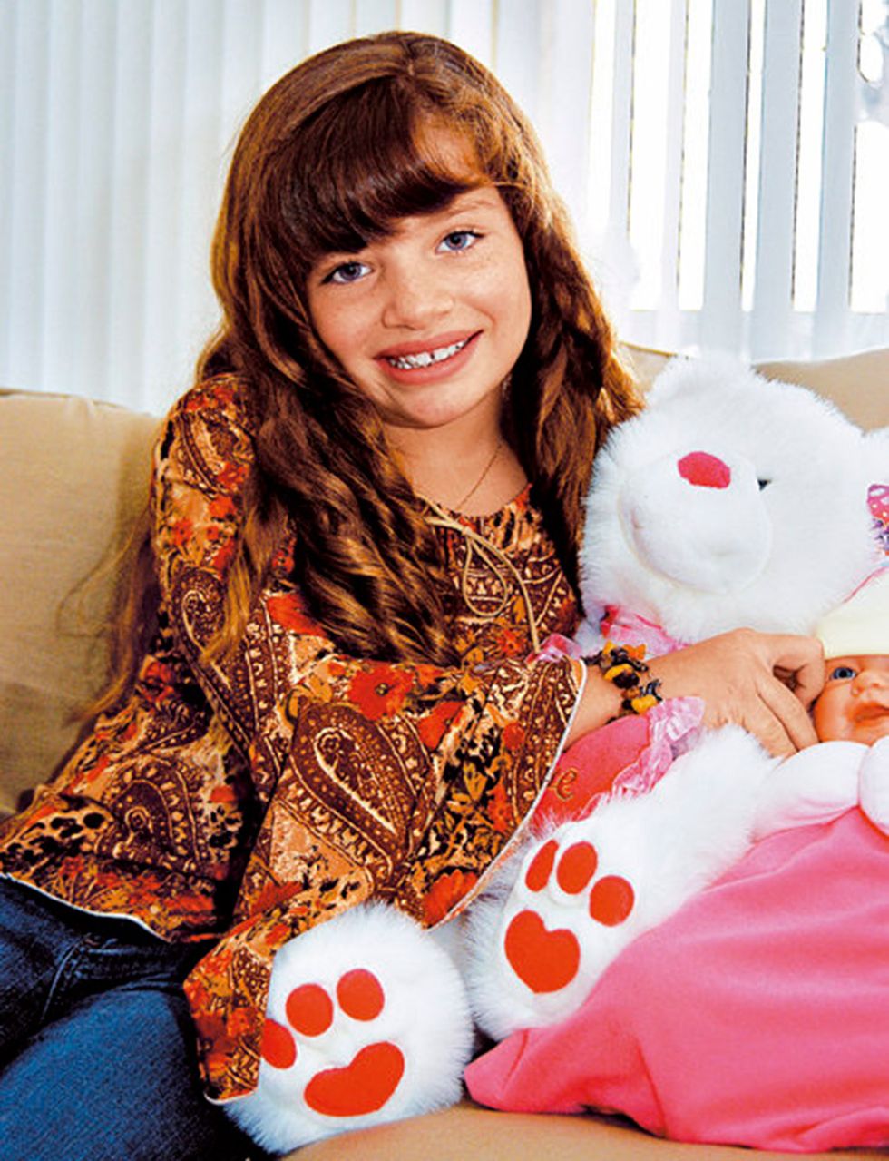 Brown hair, Textile, Long hair, Sitting, Stuffed toy, Teddy bear, Pillow, Smile, 