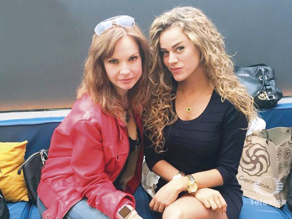 Sitting, Fashion accessory, Bag, Jacket, Luggage and bags, Jewellery, Blond, Thigh, Necklace, Long hair, 
