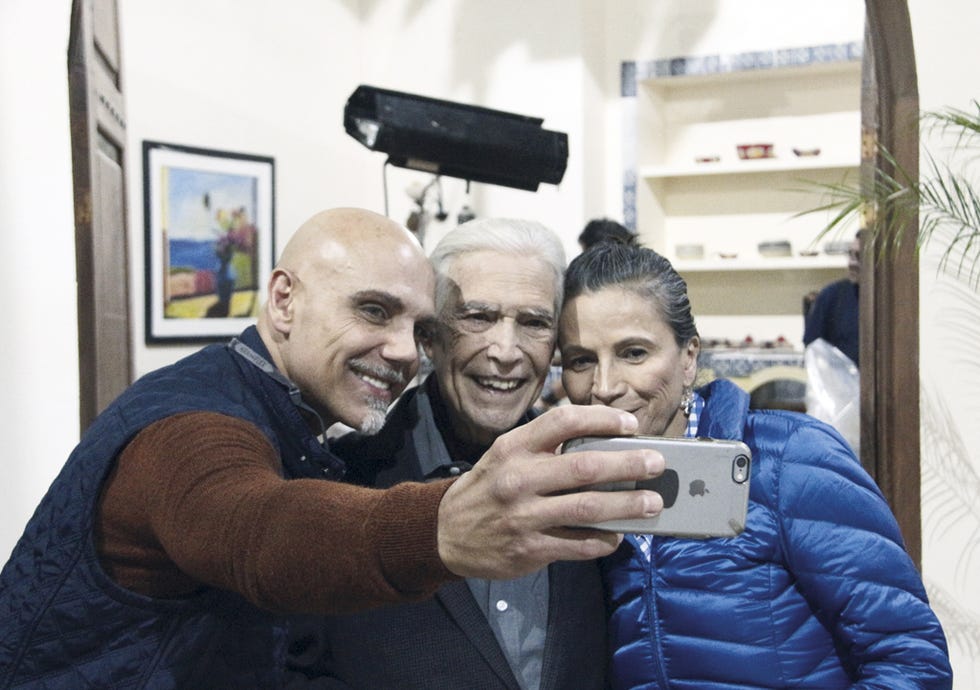 Ear, Smile, Tooth, Sweater, Picture frame, Camera, Love, Wrinkle, Laugh, Cameras & optics, 