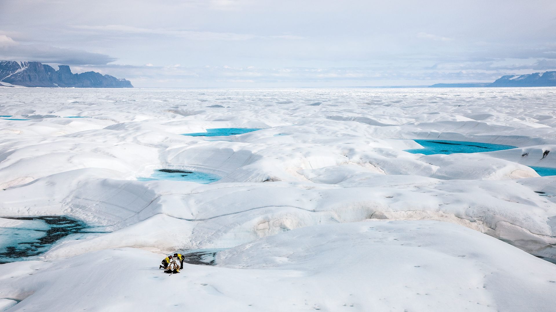 glaciologist jason box, left, at work on the petermann glacier on greenland's northwest coast, which has lost mass at an accelerated pace in recent years box and his family left ohio state for europe a couple years ago, and he is relieved to have escaped america's culture of climate change denial