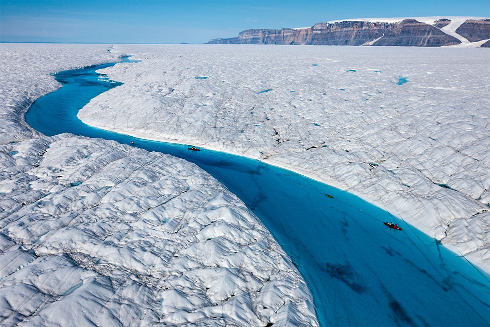 Kayaking the melt-water, Petermann Glacier.