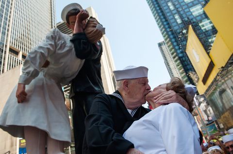 NEW YORK, NY - AUGUST 14: World War II Veterans Ray and Ellie Williams recreate the iconic Alfred Eisenstaedt photograph in Times Square on August 14, 2015 in New York City. The Williams, Navy veterans also celebrating their 70th wedding anniversary, recreated the kiss as part of a ceremony remembering the 70th anniversary of Victory in Japan Day.  (Photo by Bryan Thomas/Getty Images)