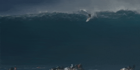 Surfer Takes on Huge Wave in Hawaii, Falls Head First into Jaws