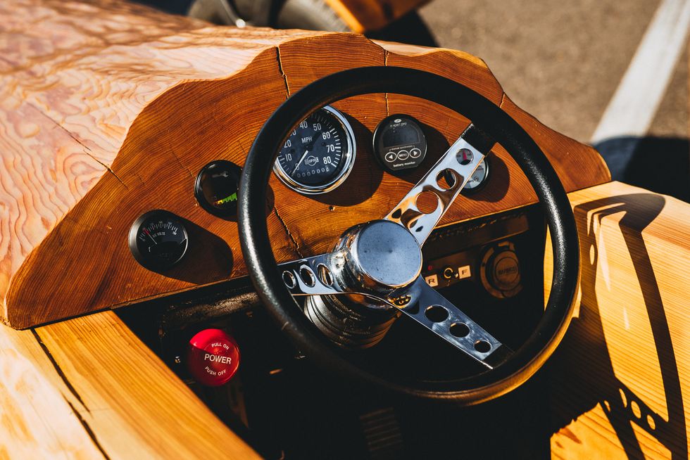 Wood, Steering part, Steering wheel, Speedometer, Gauge, Hardwood, Wood stain, Orange, Tachometer, Measuring instrument, 