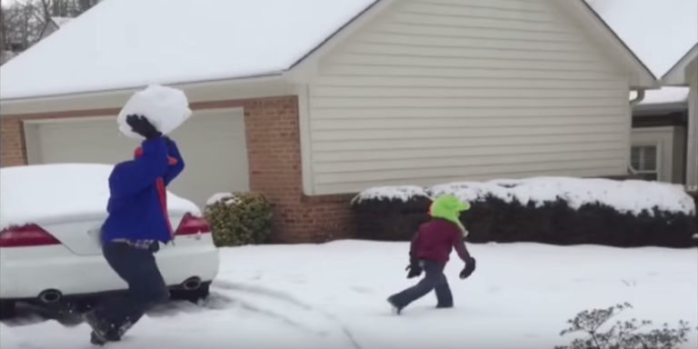 Watch a Dad Throw a Giant Snowball at His Kid for Some Reason