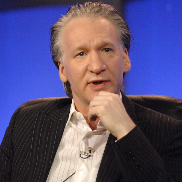 Bill Maher sitting in a chair
