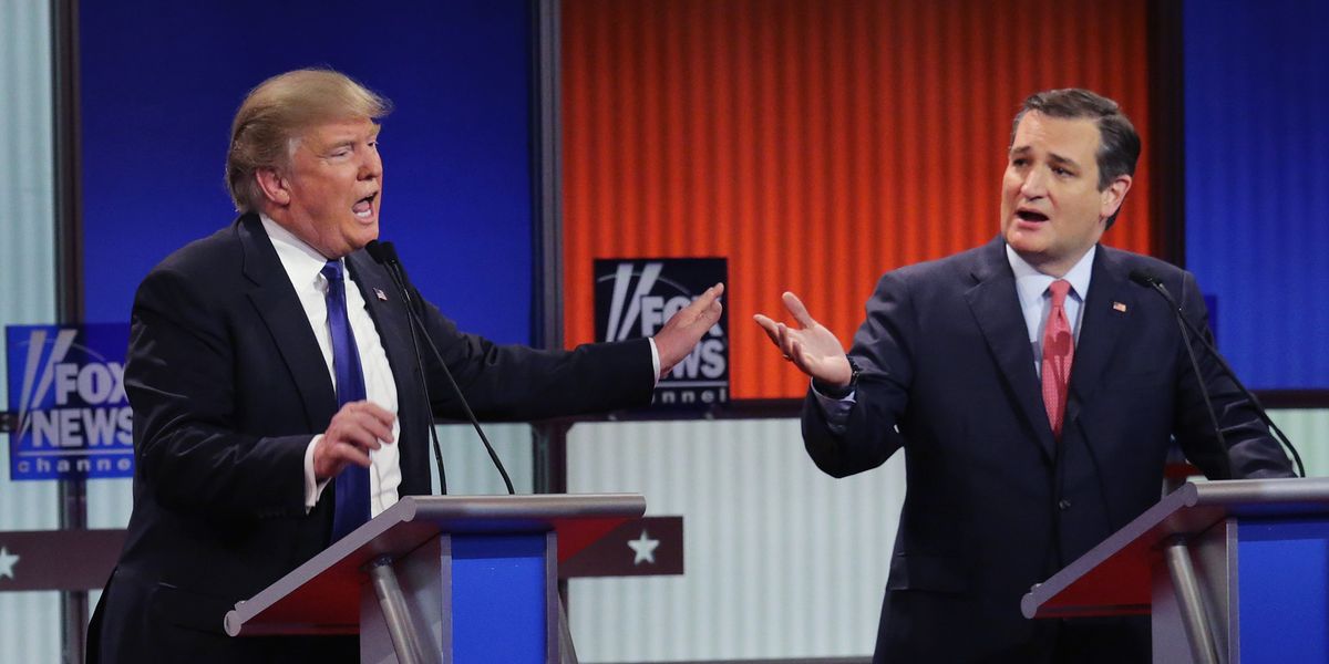 Donald Trump and Ted Cruz stand at podiums during a GOP primary debate