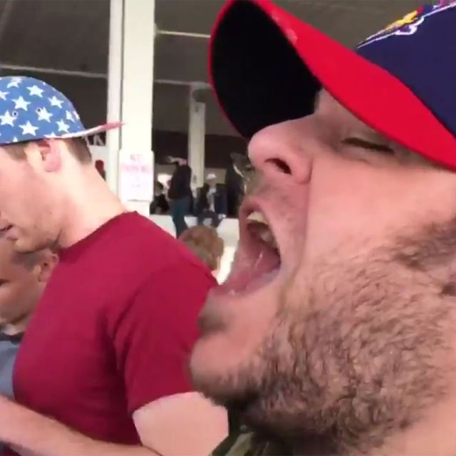 a white man with his mouth open wide, screaming