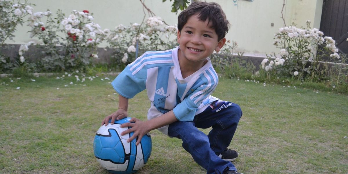 Afghan child gets a Lionel Messi jersey: How sports build bridges