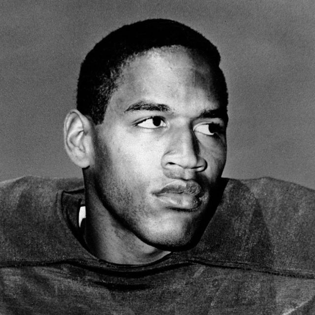 black and white image of young OJ Simpson in football uniform