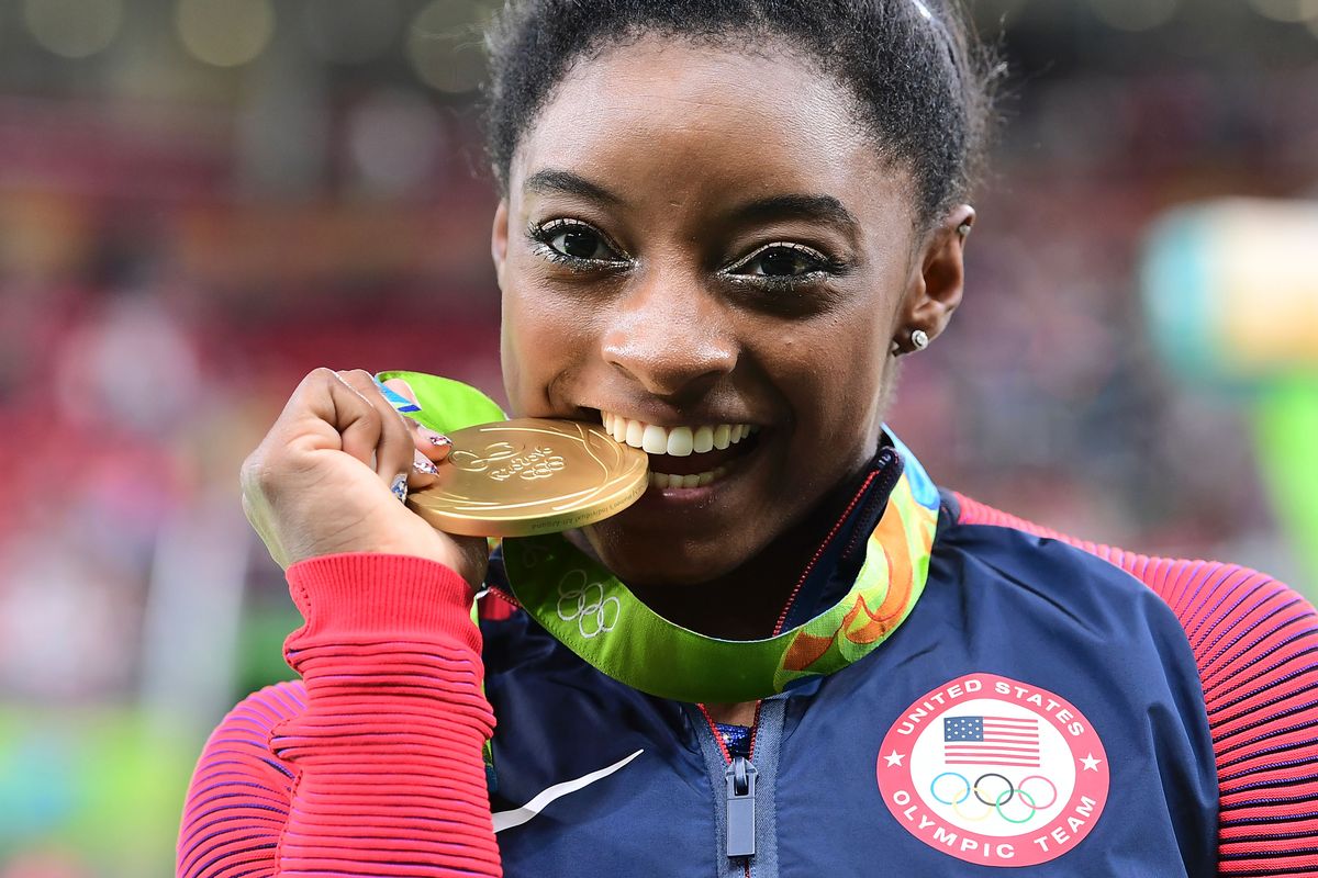 Hairstyle, Earrings, Eyelash, Tooth, Award, Gold medal, Portrait photography, Eating, Snack, 