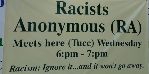 A sign reads: Racists Anonymous meets here Wednesday. Racism: Ignore it... and it won't go away.