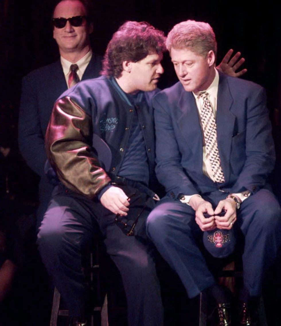 US President Bill Clinton (R) talks with his brother Roger Clinton (L), as US actor Jim Belushi (L) stands by, during a political fundraiser at the 'House of Blues' club in Los Angeles, 21 September. President Clinton is wrapping up a five day cross country campaign fundraising trip with the event at the club. (Electronic Image) AFP PHOTO (Photo credit should read J. DAVID AKE/AFP/Getty Images)