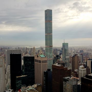 <p>The tallest all-residential skyscraper in the world includes 104 luxury condominiums spread out over its 88 floors. Designed by Rafael Vinoly, the concrete-core building opened in 2014 and, with a base of 33,000 square feet, was able to slide into Manhattan on the lot formerly  home to the Drake Hotel. Located between E 56th and E 57th streets and just one block from Trump Tower, 432 Park Ave has some of the priciest apartments in all of New York City, and that's saying something. </p>