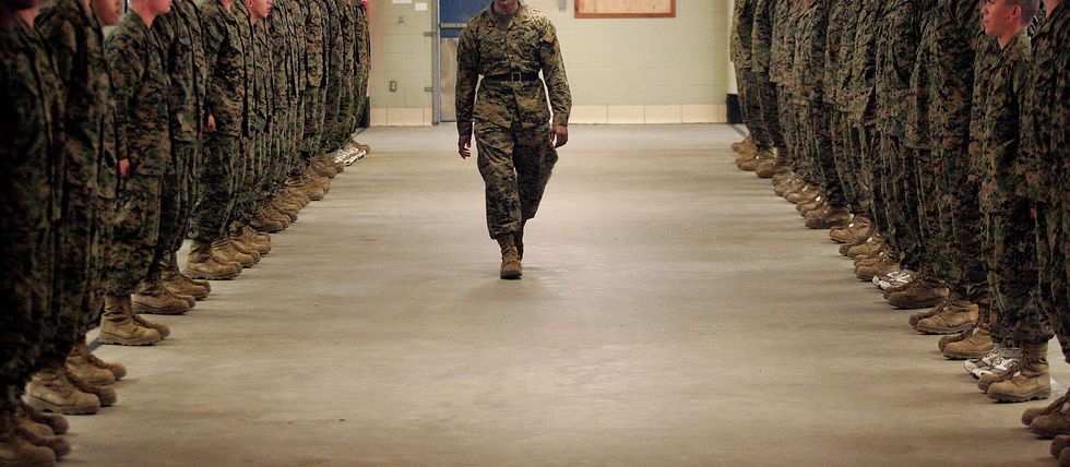 Soldier, Military uniform, Military person, Military camouflage, Army, Camouflage, Military organization, Floor, Military, Cargo pants, 