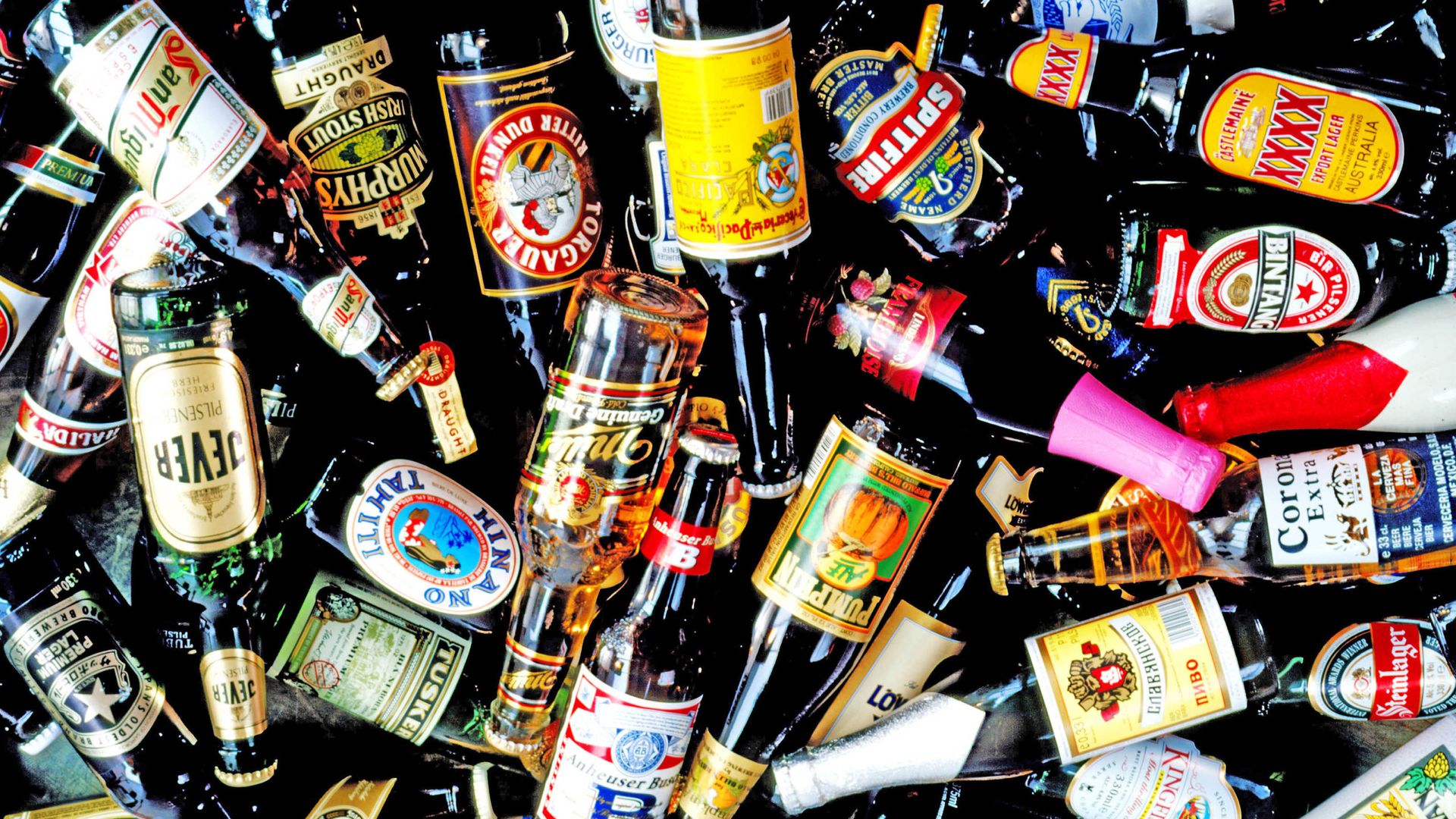 Bottle, Alcohol, Alcoholic beverage, Glass bottle, Drink, Distilled beverage, Logo, Label, Barware, Bottle cap, 