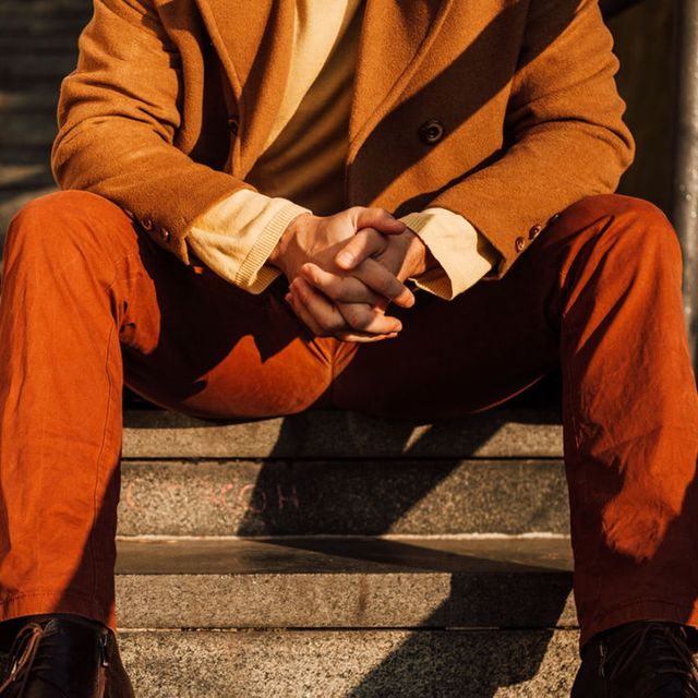 Sitting, Stairs, Suit trousers, Orange, Knee, Street fashion, Pocket, Cuff, 