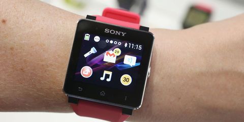 Electronic device, Watch, Wrist, Red, Display device, Technology, Gadget, Magenta, Font, Watch accessory, 