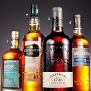 four scotch bottles