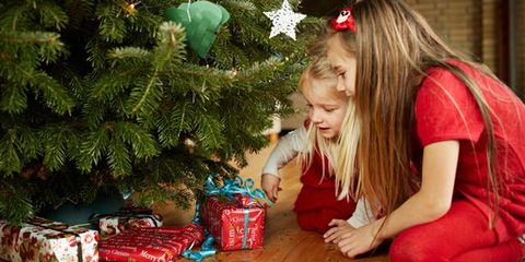 Red, Christmas decoration, Holiday, Carmine, Christmas, Wood flooring, Christmas eve, Christmas ornament, Interior design, Laminate flooring, 