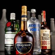 Glass bottle, Bottle, Alcohol, Alcoholic beverage, Liquid, Drink, Distilled beverage, Barware, Logo, Bottle cap, 