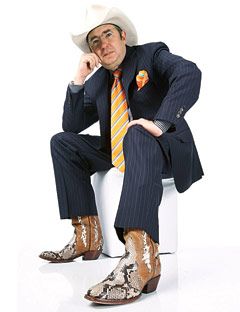 barry sonnenfeld wearing a cowboy hat, a pinstripe suit and cowboy boots of sheep and boa leather