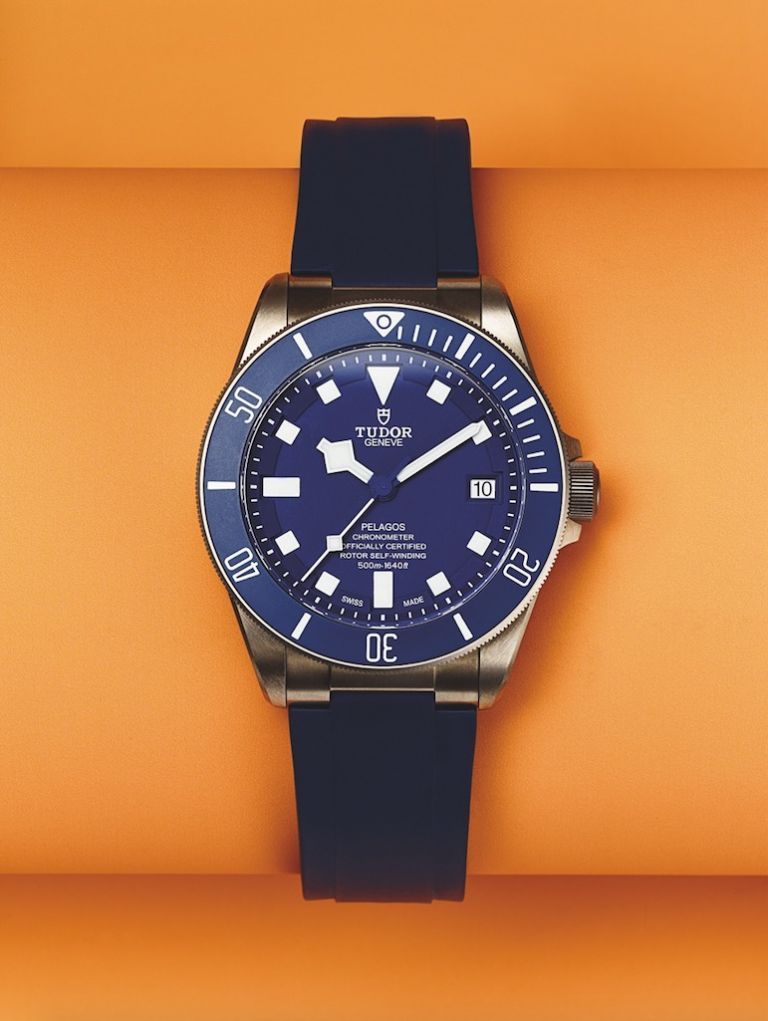 Blue, Product, Watch, Glass, Analog watch, Watch accessory, Font, Fashion accessory, Orange, Electric blue, 