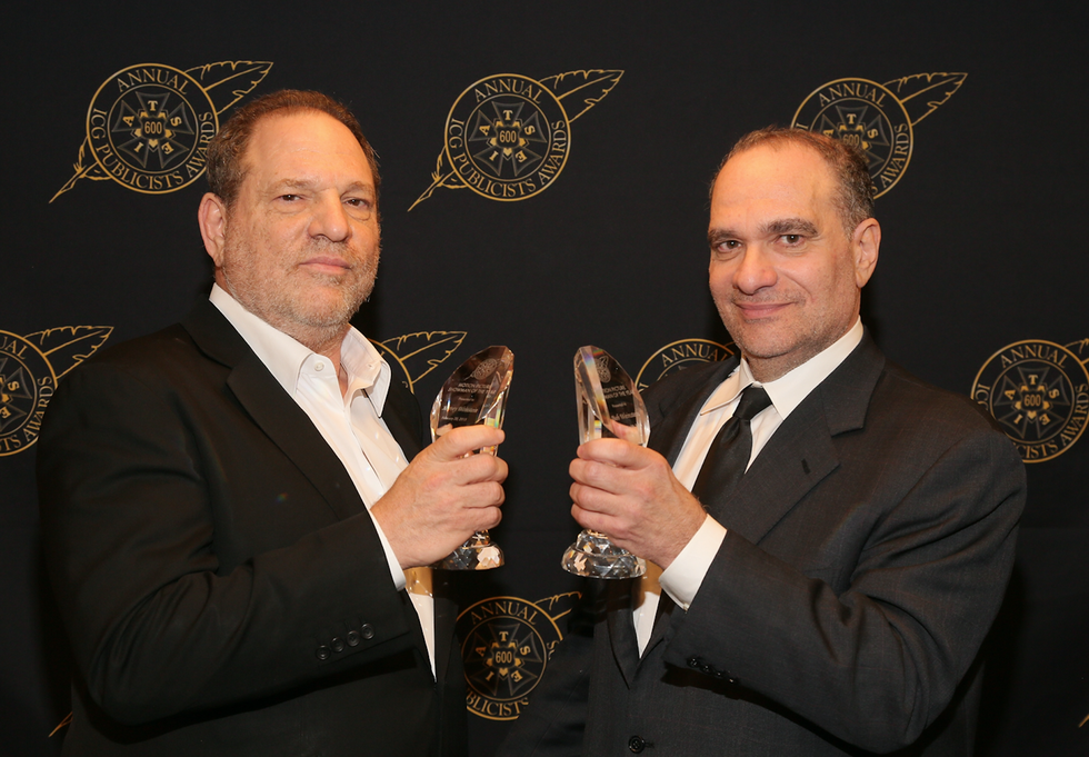 Harvey Weinstein (L) and Bob Weinstein pose with the Motion Picture Showmanship Award