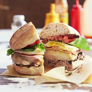 chicken chivito sandwich with chicken and eggs sliced in half