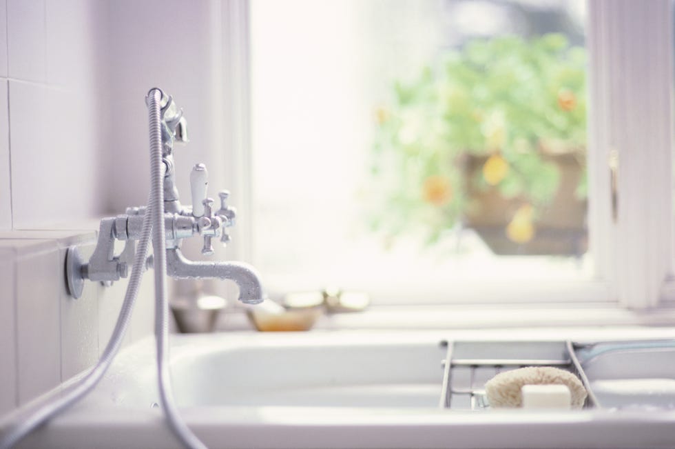 bath tub in front of a window
