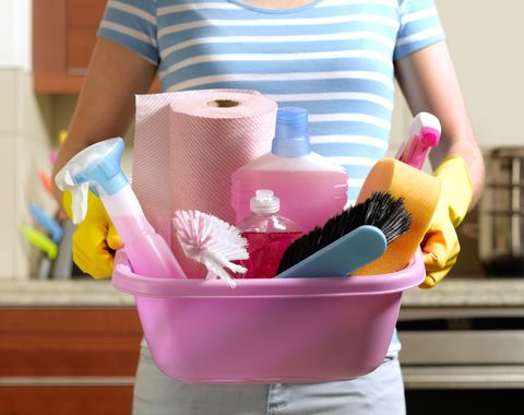 woman carry cleaning supplies
