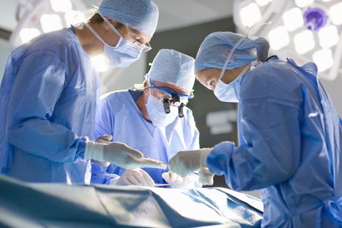 surgeons operating on a person