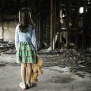 Girl Looking at Fire Damage