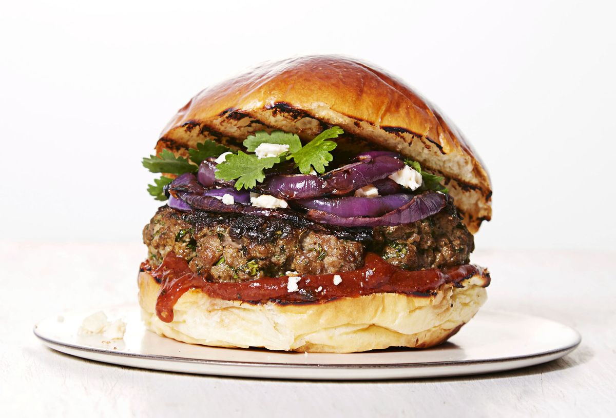 a close up of a mediterranean spiced burger